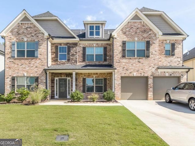 view of front of home featuring a front lawn and a garage