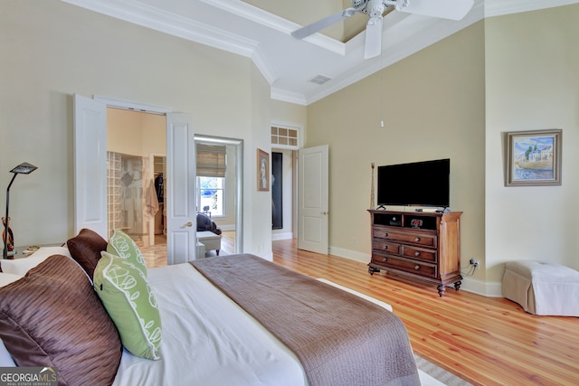 bedroom with ornamental molding, hardwood / wood-style flooring, and ceiling fan