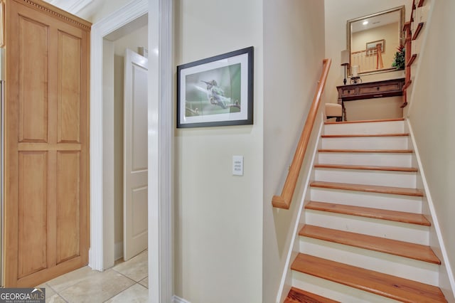 staircase featuring tile patterned floors