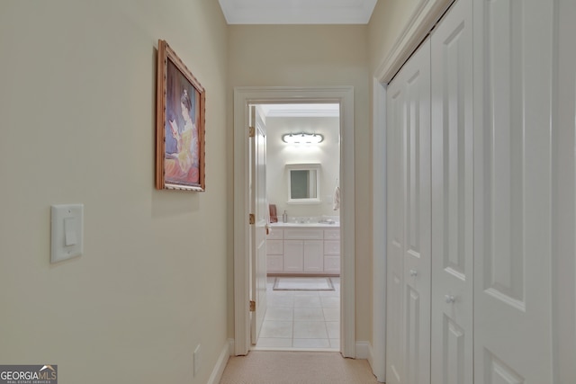 hall featuring light tile patterned flooring