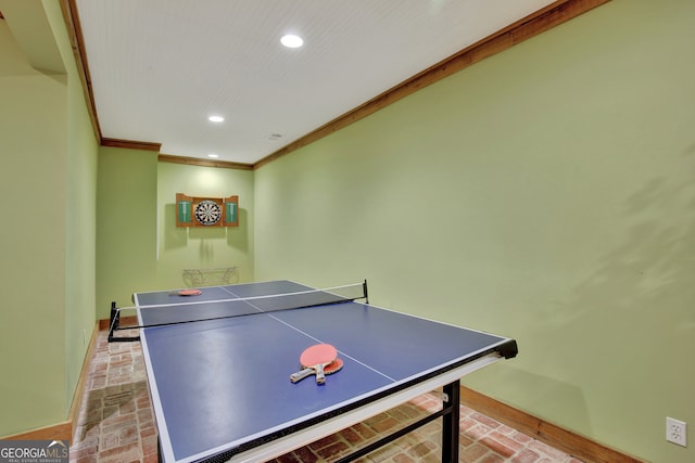 game room with crown molding