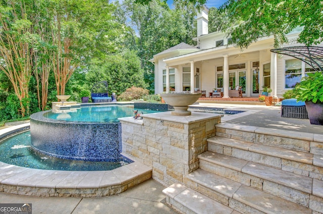 view of pool featuring a patio area