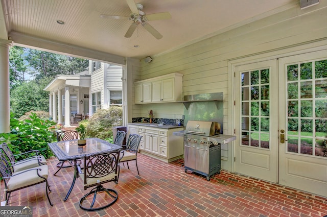 view of patio with sink, a grill, and ceiling fan