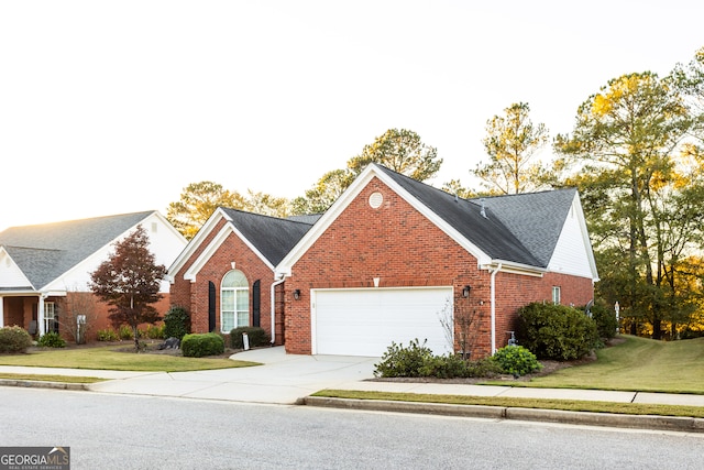 view of front facade featuring a front yard and a garage