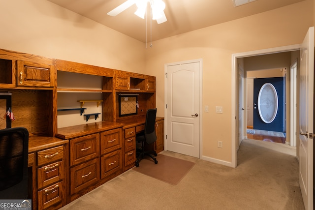 office space featuring light carpet, vaulted ceiling, and ceiling fan