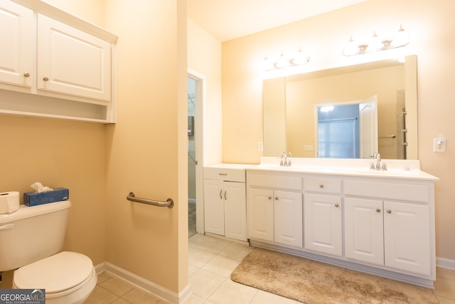 bathroom with tile patterned floors, vanity, and toilet