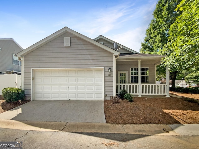 view of front of home featuring a porch and a garage