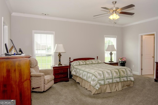 carpeted bedroom with ceiling fan and crown molding