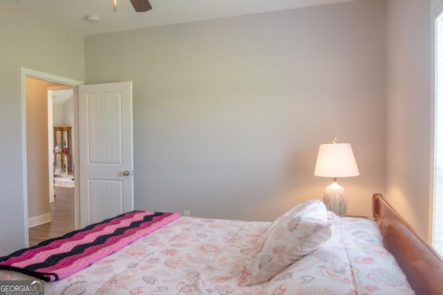 bedroom with ceiling fan and wood-type flooring