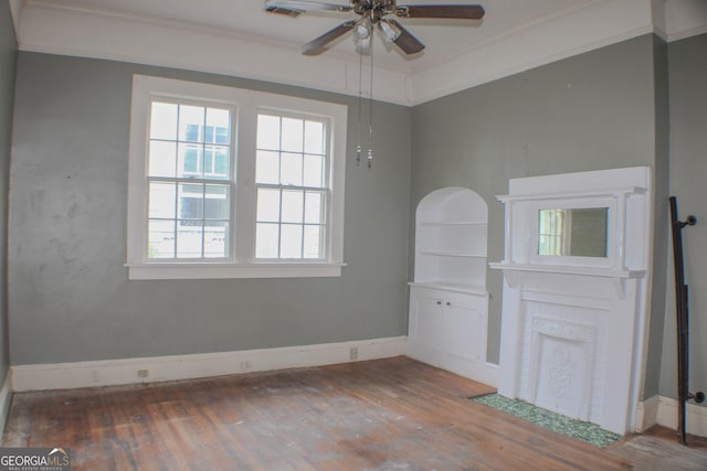 unfurnished room featuring dark hardwood / wood-style flooring, crown molding, and ceiling fan