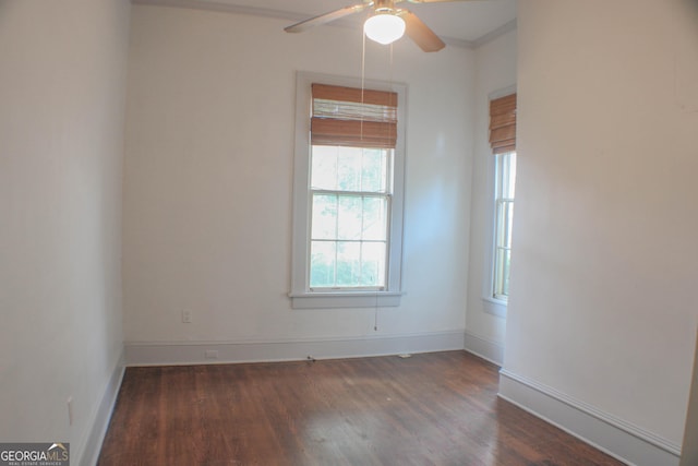 unfurnished room featuring ceiling fan and dark hardwood / wood-style flooring