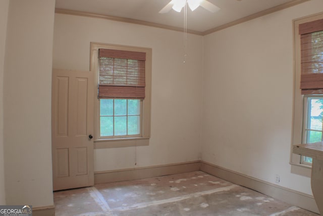 unfurnished room featuring ceiling fan, ornamental molding, and a healthy amount of sunlight