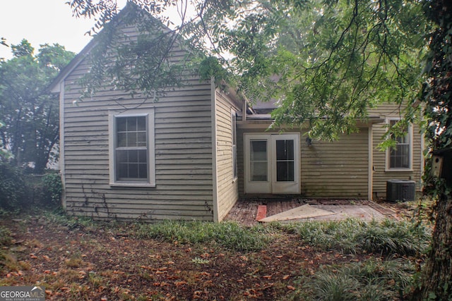 back of house featuring central AC unit and a patio