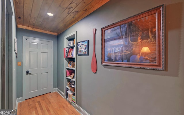 doorway to outside with wooden ceiling, baseboards, recessed lighting, and light wood-style floors