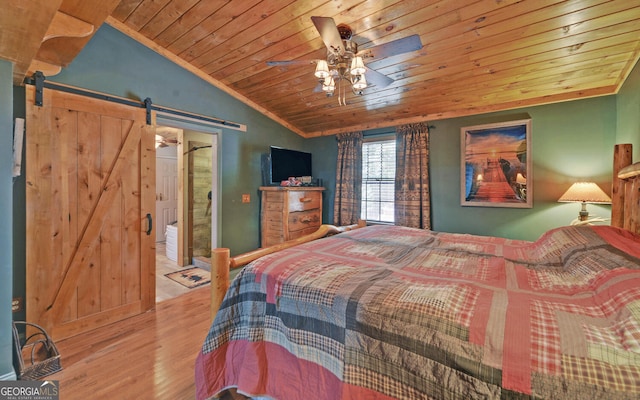 bedroom with light hardwood / wood-style flooring, ceiling fan, vaulted ceiling, wooden ceiling, and a barn door