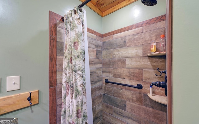 full bath with tiled shower and wooden ceiling