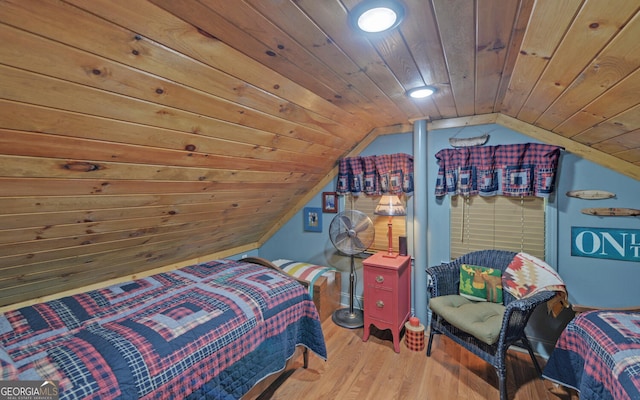 bedroom with hardwood / wood-style flooring, vaulted ceiling, and wooden ceiling