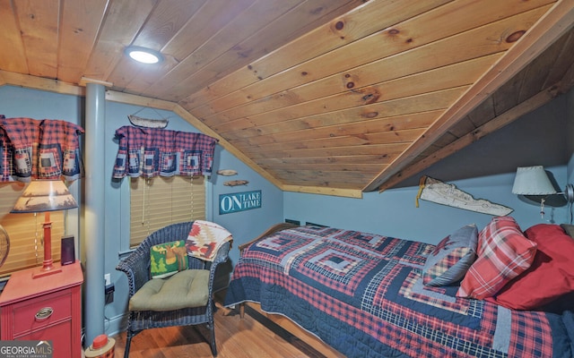 bedroom featuring hardwood / wood-style flooring, lofted ceiling, and wooden ceiling