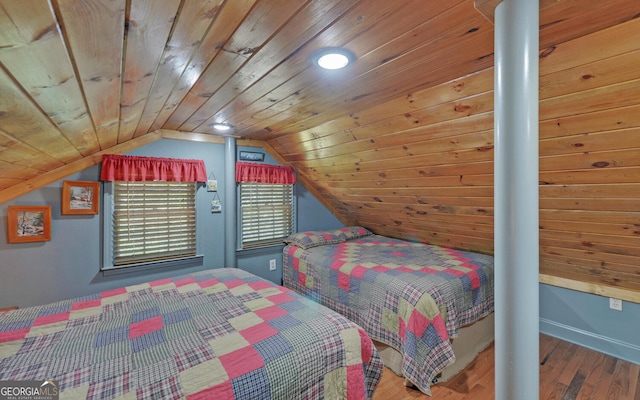 bedroom with baseboards, wooden ceiling, wood finished floors, and vaulted ceiling
