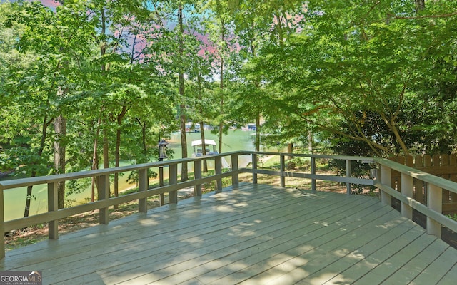 deck featuring a water view