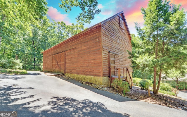 view of side of property featuring an outdoor structure