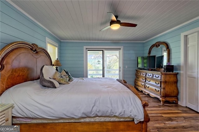 bedroom with ceiling fan, access to outside, wooden ceiling, and hardwood / wood-style flooring