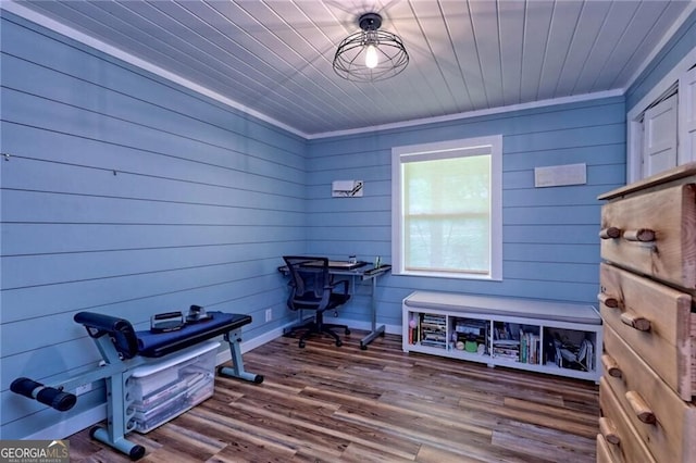 miscellaneous room with wood walls, wood ceiling, crown molding, and hardwood / wood-style floors