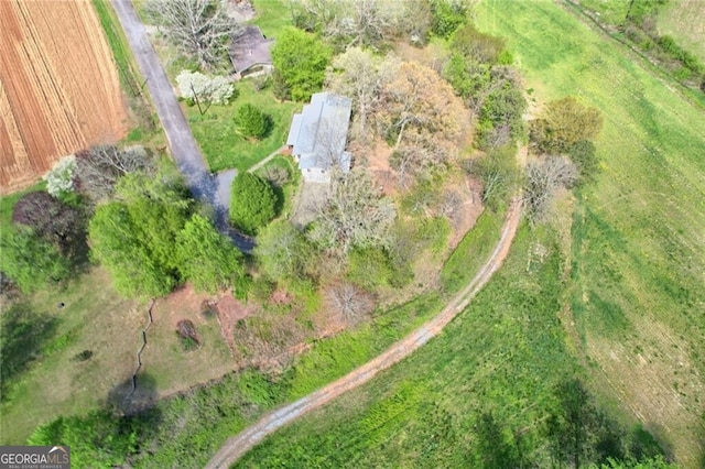 birds eye view of property featuring a rural view