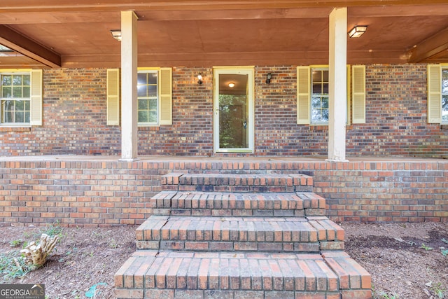 property entrance featuring a porch