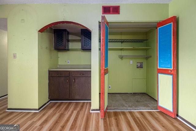 interior space featuring hardwood / wood-style floors and a textured ceiling