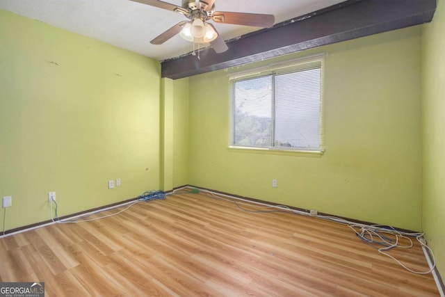 unfurnished room featuring light hardwood / wood-style floors and ceiling fan