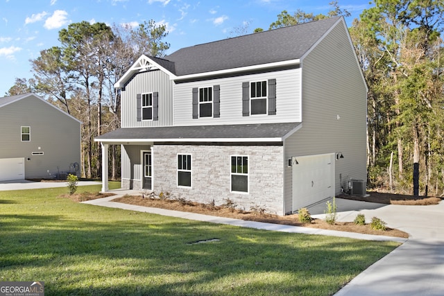 view of front property with cooling unit, a front lawn, and a garage