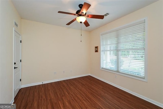 empty room featuring ceiling fan and wood-type flooring