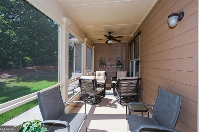 sunroom / solarium with ceiling fan