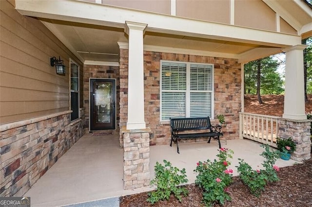 property entrance with covered porch