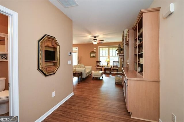 hallway featuring dark hardwood / wood-style flooring