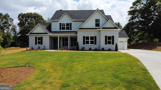 view of front facade with a garage and a front yard