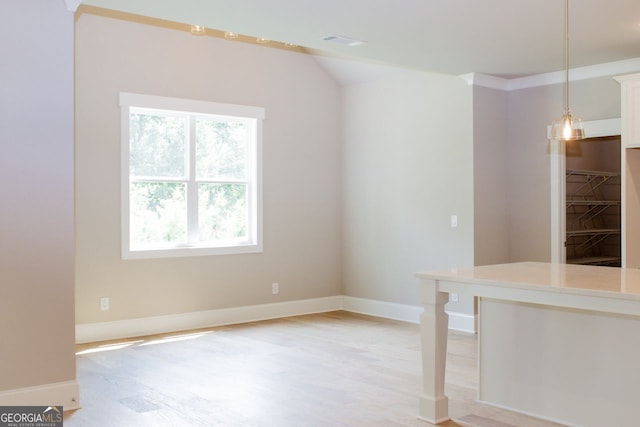 spare room featuring light hardwood / wood-style flooring