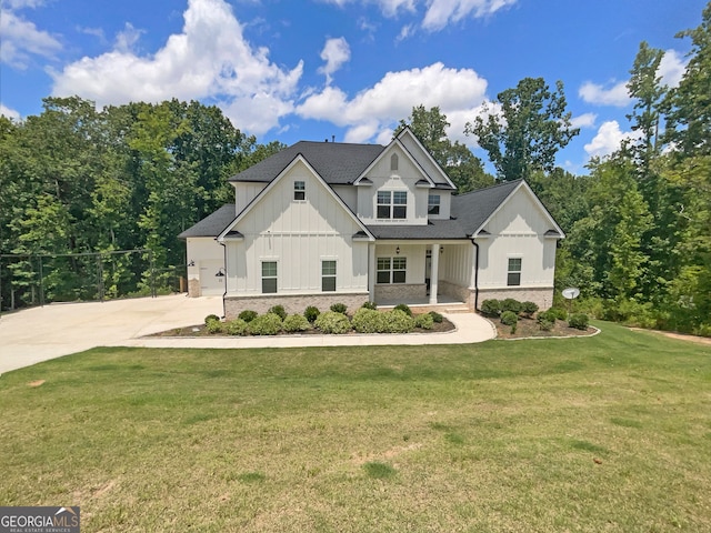 modern inspired farmhouse with a front lawn