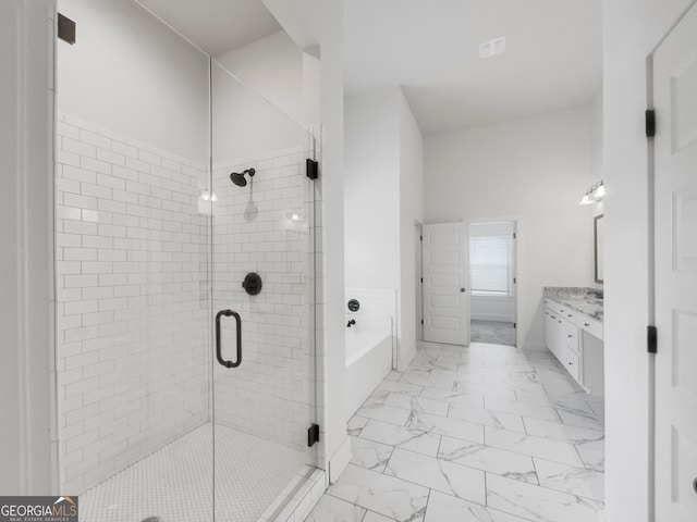 bathroom featuring vanity, separate shower and tub, and tile patterned floors