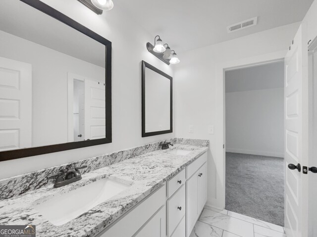 bathroom with vanity and tile patterned flooring