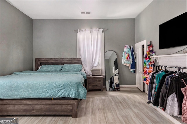 bedroom featuring light wood-type flooring