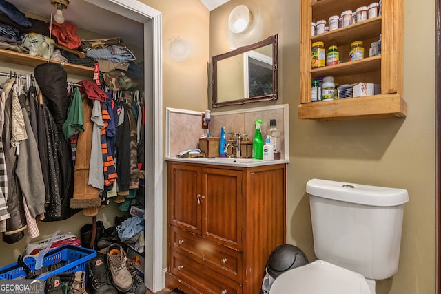 bathroom featuring toilet and vanity