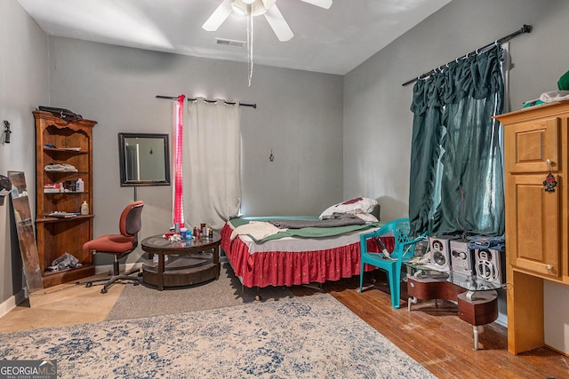 bedroom featuring wood-type flooring and ceiling fan