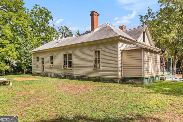 view of home's exterior featuring a lawn