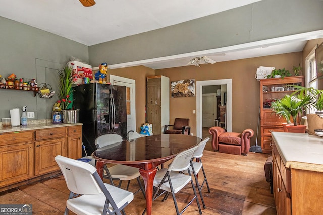 dining room featuring ceiling fan and light wood-type flooring
