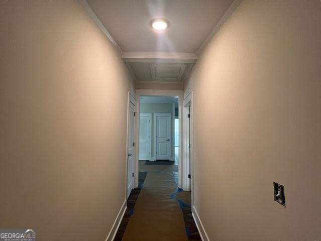 hall featuring beamed ceiling