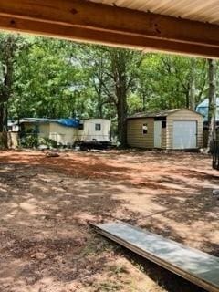 view of yard with a storage unit