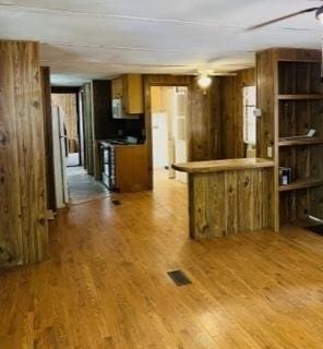 kitchen with hardwood / wood-style flooring and kitchen peninsula