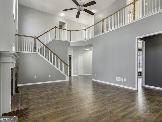 1301 Crosswind Pl, Mcdonough, GA 30252 - unfurnished living room with baseboards, stairway, a ceiling fan, visible vents, and wood finished floors